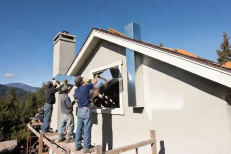 roof-workers-vent-installation Installation of rigid metal vent systems